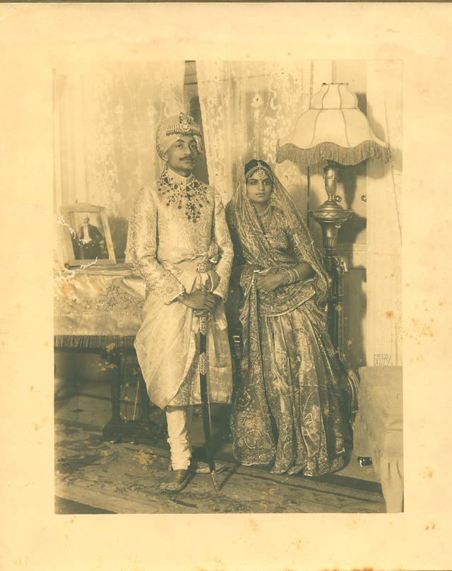 Faded 1920s studio portrait of an Indian couple